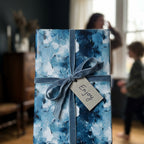 Luxury blue oil paint wrapping paper with velvet ribbon and gift tag by Wrapped Studios.