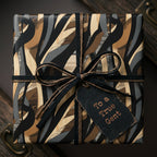 Modern abstract luxury gift wrap in earthy tones. Wrapped with jute twine and a "To a True Gent" tag.