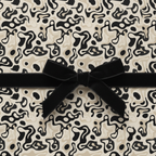Luxury abstract wrapping paper with a black velvet ribbon and bow, perfect for modern gift wrap.