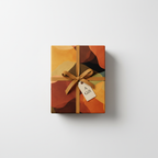 Modern abstract wrapping paper in warm orange, brown, and gold tones, tied with a matching ribbon and "A Gift" tag.