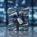 Modern blue and white winter gift wrap with navy satin ribbon and "A Special Winter's Gift" tag.