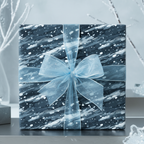 Elegant gift wrapped in blue abstract print paper with a sheer blue ribbon and bow.