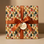 Retro guitar wrapping paper with a copper ribbon on a birthday gift box by Wrapped Studios.