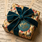 Vintage guitar wrapping paper with teal velvet bow on sheet music background by Wrapped Studios.