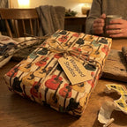 Retro guitar wrapping paper by Wrapped Studios on a gift box tied with rustic twine.