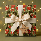 Black Santa Christmas wrapping paper on a gift with a cream ribbon by Wrapped Studios.