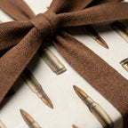 Bullet pattern wrapping paper with a brown ribbon, masculine hunting gift wrap by Wrapped Studios.