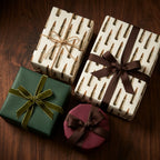 Bullet wrapping paper with vintage ammo pattern on rustic gifts with brown ribbons, by Wrapped Studios.