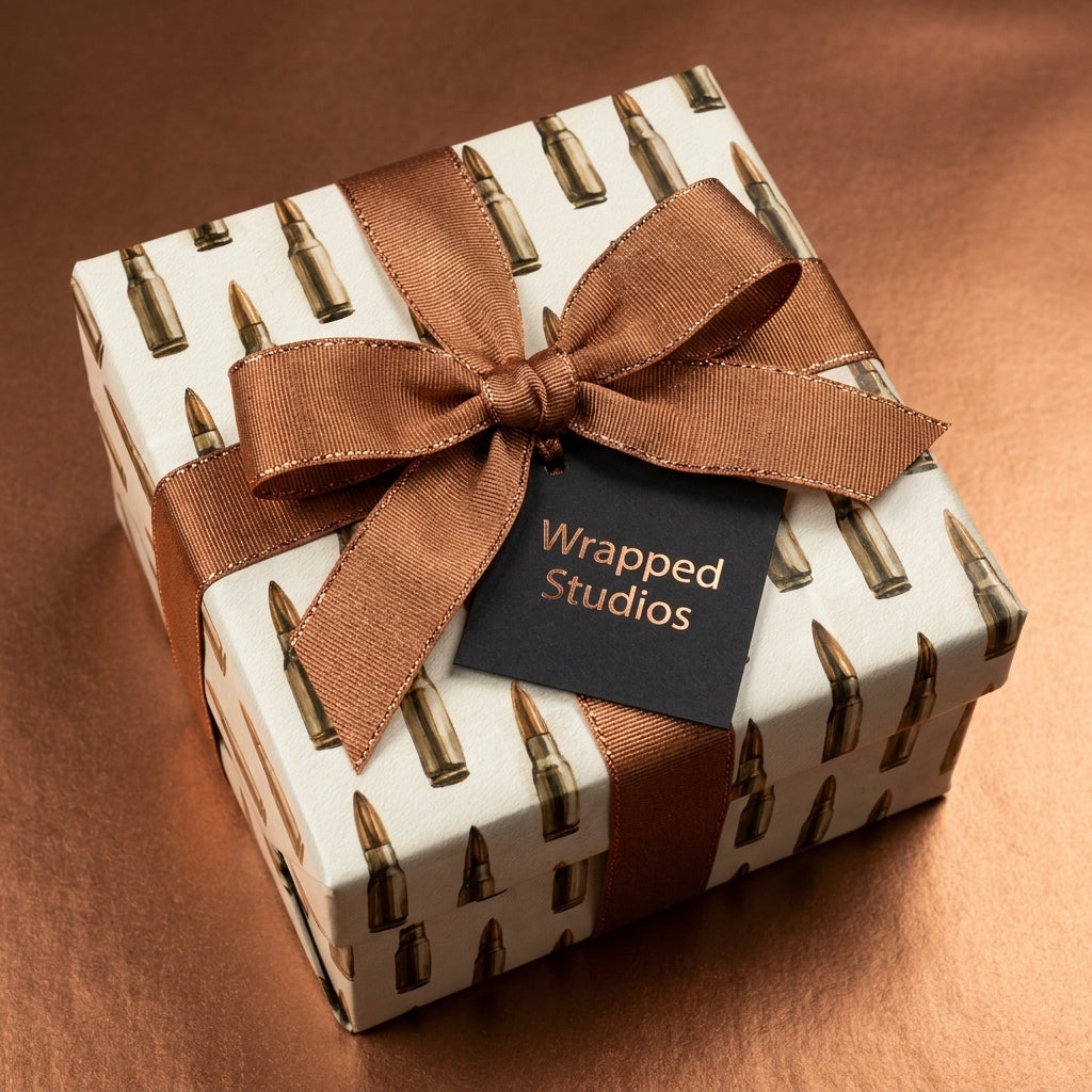 Bullet wrapping paper with copper ribbon and a gift tag by Wrapped Studios.