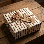 Masculine bullet wrapping paper by Wrapped Studios on a rustic gift box with twine and a Range Time tag.