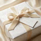 Luxury white angel Christmas gift wrap with a cream velvet bow by Wrapped Studios.