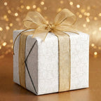 Elegant angel Christmas wrapping paper with a sheer gold bow on a holiday gift box by Wrapped Studios.
