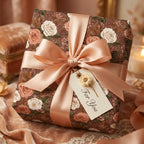 Luxury vintage floral wrapping paper with dusty roses and a champagne satin bow by Wrapped Studios.