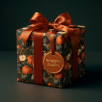 Vintage pumpkin gift wrap with copper satin ribbon on a luxury autumn gift box by Wrapped Studios.