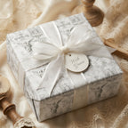 Vintage angel toile wrapping paper with a white ribbon for luxury wedding gifts, by Wrapped Studios.