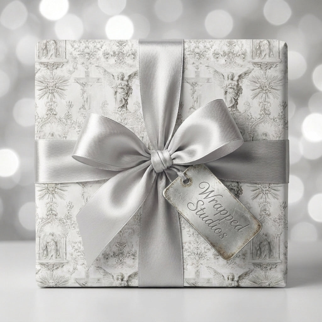 Vintage angel wrapping paper with a luxury silver satin bow and Wrapped Studios gift tag.