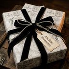 Vintage gothic wrapping paper with black velvet ribbon and gift tag by Wrapped Studios.