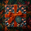 Elegant floral gift box wrapped in luxurious burnt orange velvet ribbon from Wrapped Studios.