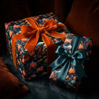 Elegant gifts wrapped in dark floral wrapping paper with orange and teal ribbon bows. Wrapped Studios.
