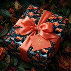 Elegant floral wrapping paper with a coral ribbon and "Best Wishes" tag.