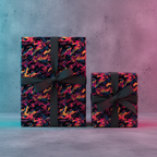 Modern gift boxes wrapped in vibrant, abstract print wrapping paper with charcoal ribbon.