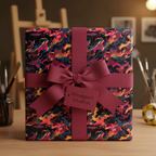 Abstract gift wrap with a plum ribbon on a box, ideal for a unique birthday or special occasion present.
