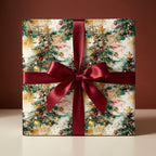 Christmas gift wrap featuring an artistic tree pattern and tied with a satin burgundy ribbon.