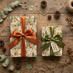 Rustic botanical floral wrapping paper with elegant satin bows by Wrapped Studios.
