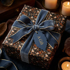Luxury vintage floral wrapping paper by Wrapped Studios on a gift box with a slate blue velvet bow.
