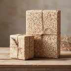 Rustic floral wrapping paper on square gifts with twine, botanical-themed vintage gift wrap for birthdays or holidays.