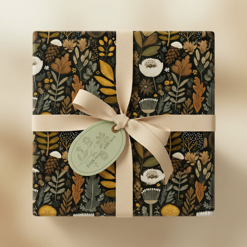 Square gift wrapped in elegant floral wrapping paper with tan ribbon.