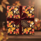 Autumnal floral wrapping paper with a velvet burgundy ribbon and gift tag.