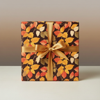 Autumn leaf wrapping paper with gold ribbon, perfect for fall birthday gifts.