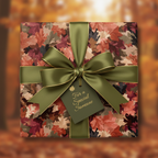 Square gift wrapped in autumn leaf wrapping paper with green ribbon and "For a Special Someone" tag.