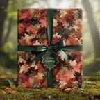 Autumn leaves gift wrap with green ribbon on mossy forest floor.