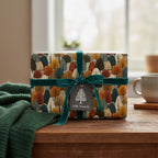 Gift wrapped in modern tree-patterned wrapping paper with a teal velvet ribbon and "With Warmth" tag.