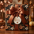 Luxury Thanksgiving wrapping paper with a pumpkin pattern and copper bow by Wrapped Studios.