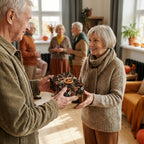 Senior couple exchanging a gift in cozy fall wrapping paper with pumpkins by Wrapped Studios.