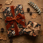 Luxury fall wrapping paper with pumpkin floral pattern and velvet ribbon by Wrapped Studios.