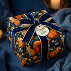 Elegant gift wrap with a blue velvet ribbon, featuring a cute squirrel and floral pattern perfect for unique birthday wrapping paper.