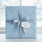Elegant baby blue wrapping paper with white pattern, tied with a satin ribbon and gift tag.