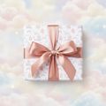 Dreamy castle and rainbow pastel wrapping paper with a rose gold satin bow, perfect for a magical birthday gift.