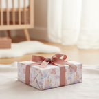 Cute pastel castle wrapping paper with pink ribbon, perfect for a baby shower or kids' birthday gift.