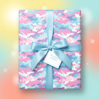 Pastel camo birthday wrapping paper with a light blue satin ribbon and bow.
