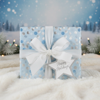 Light blue Christmas gift wrap with silver dots and a white satin bow, on a snowy background.