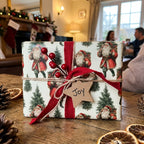 Vintage Santa Claus Christmas wrapping paper with a red ribbon and Joy tag, by Wrapped Studios.
