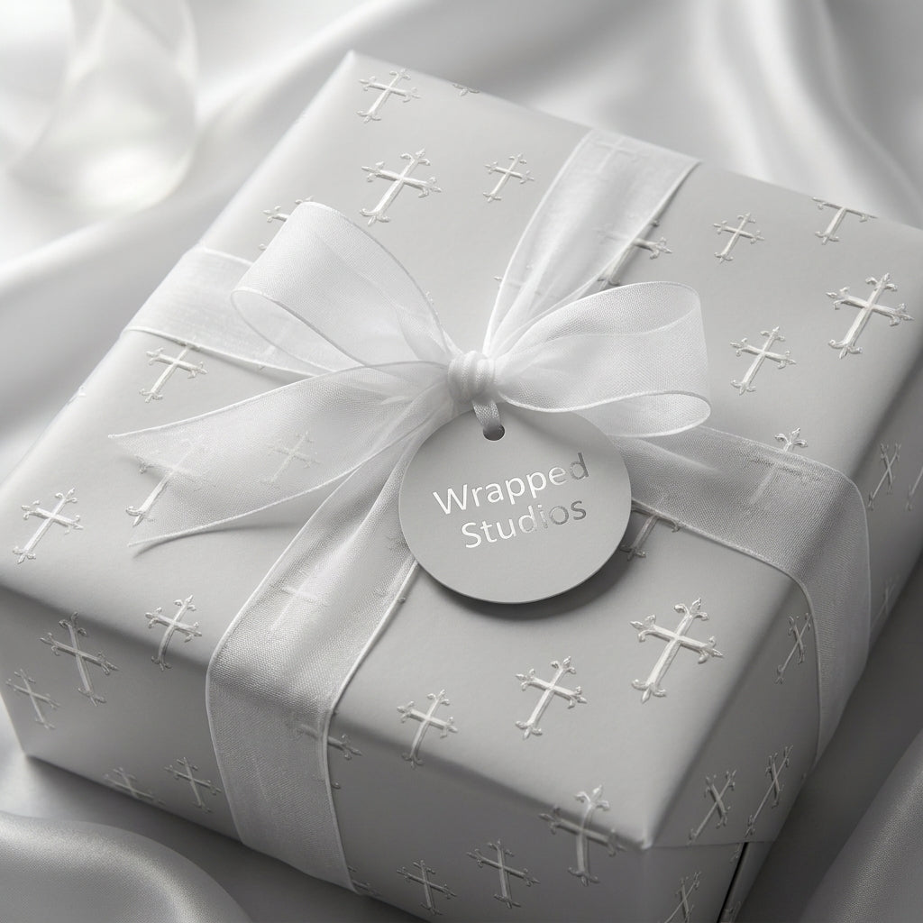 Silver cross baptism and christening wrapping paper with a white ribbon by Wrapped Studios.