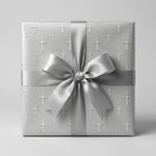 Silver baptism and christening gift wrap with cross pattern and satin bow by Wrapped Studios.