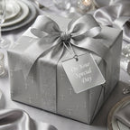 Silver baptism wrapping paper with cross pattern on a ribboned gift box by Wrapped Studios.