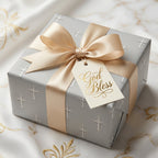 Baptism wrapping paper with silver crosses, gold ribbon, and a God Bless tag by Wrapped Studios.